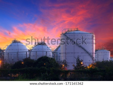 big Industrial oil tanks in a refinery at twilight