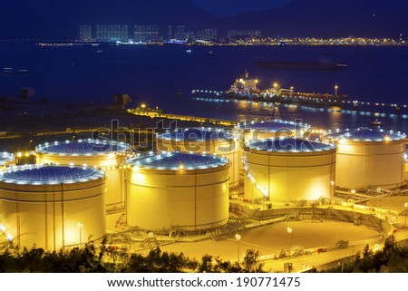 Big Industrial oil tanks in a refinery at night