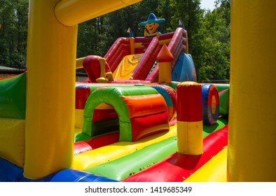 Big inflatable boat slide in playground - Shutterstock ID 1419685349