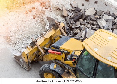 Big Jackhammer Drill Drilling Road.Heavy Machinery Crushing Asphalt For Stormwater Drain Repair