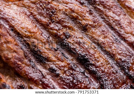 Big juicy grilled beef steak close up
