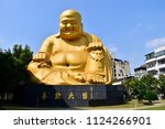 Big laughing Buddha Statue at PaoChueh Temple, a famous tourist spot in Taichung, Taiwan