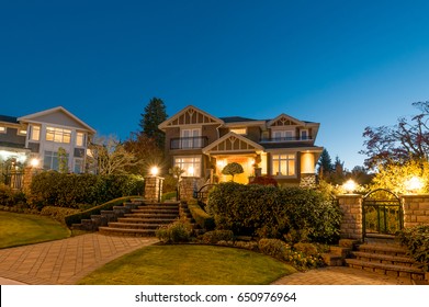 Big luxury house at night, dusk time in suburbs of Vancouver, Canada.