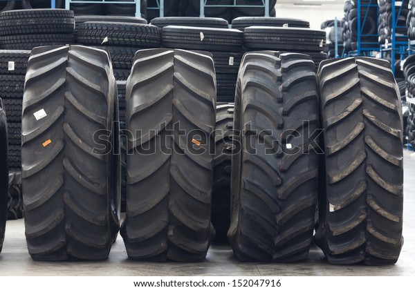 Big
machines tires stack background. Industrial
tires