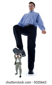 Big Man Stepping On A Little One. Conceptual View Of How Big Companies Destroy The Little Ones.