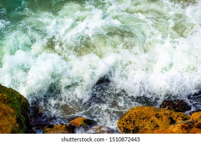 Big Mediterranean sea waves crushing on the rocky shore of Tel Aviv, Israel.