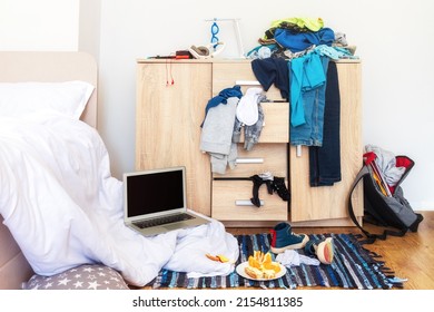 big mess in young boy's room, scattered things, unmade bed, food on floor - Powered by Shutterstock