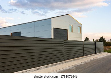 Big Metal Industrial Storage Shed Building.  Exterior Of Warehouse, No Brands On Storehouse With Copy Space.