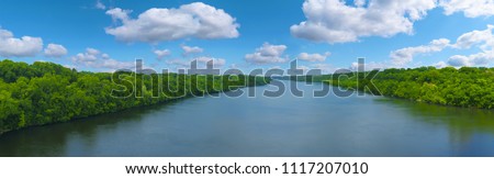 The Big Mississippi river panorama with blue sky and white clouds 