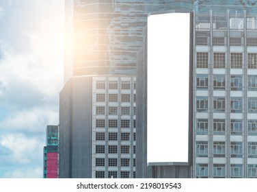 Big Modern Digital Billboard On A High Building, 3D Empty A Vertical Digital Billboard, Blue Sky Background.