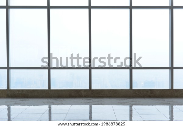 Big modern hall and window in executive office\
waiting room, modern lobby big window and blue sky with clouds.\
Modern office concept, window in skyscraper , transparent modern\
viewing platform