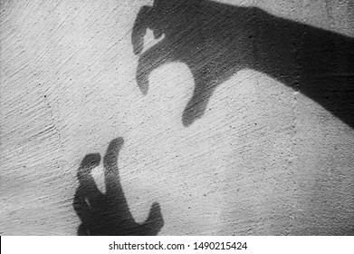 A Big Monster Claw Shadow Hallowween Concept On Wall.