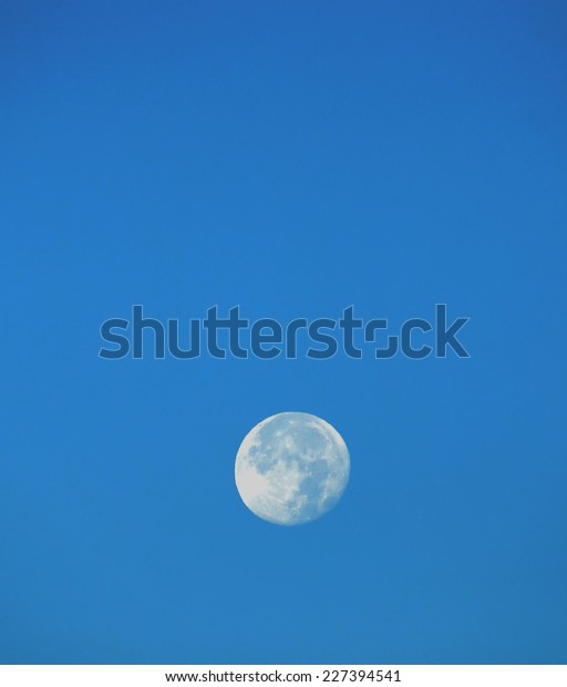 Big moon in the  blue sky.\
