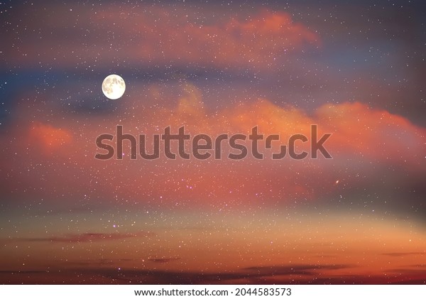 big moon on dramatic\
yellow orange pink clouds  night starry sky at blue  orange dark \
cosmic universe 