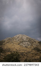 big mountain with dark clouds