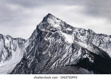 Big Mountain Peak With Snow Covered And Overcast Sky In Canada