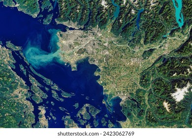 The Big Muddy, Western Edition. Flowing past the city of Vancouver, the Fraser River delivers a thick plume of sediment to the Strait. Elements of this image furnished by NASA. - Powered by Shutterstock