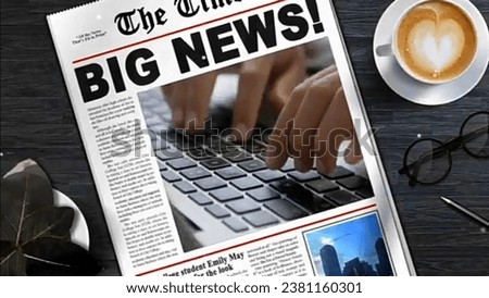 a big news newspaper which displays a picture of a hand typing accompanied by a cup of coffee and glasses 