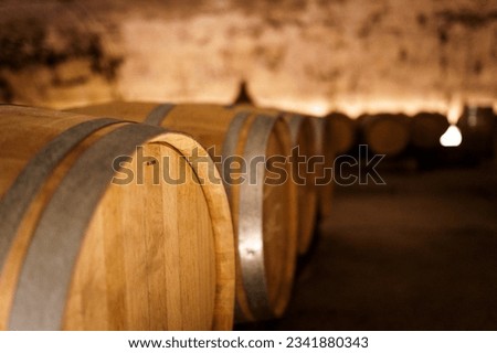 Big old oak barrels in a winecellar in  saint emilion, bordeaux, france