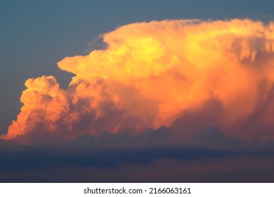 Big Orange Cumulonimbus Incus Cloud At Sunset 