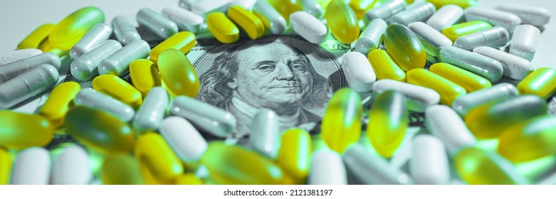 Big Pharma Conspiracy Theory. Medical Pills Lying On Top Of US Dollar Bill. Pharmacy And Healthcare Are Very Expensive. Wide Banner