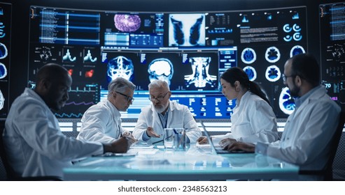 Big Pharma and Medical Device Industrial Company Laboratory Team Members Having a Medical Meeting in Front of Big Digital Screen with Advanced Treatment Experiment Reports and Patient Data - Powered by Shutterstock