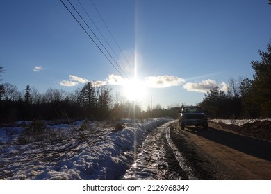 Big Pick-Up Truck On Muddy Maine Road In The Snowy Winter