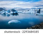 Big pieces of ice (floe) in water, ice islands, glacier and mountains, Jökulsárlón - Glacier Lagoon