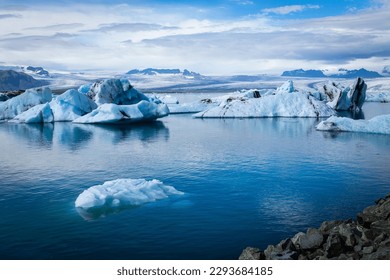 Big pieces of ice (floe) in water, ice islands, glacier and mountains, Jökulsárlón - Glacier Lagoon