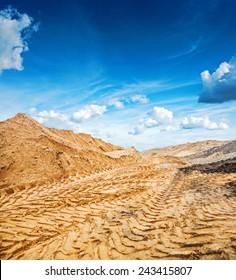 Big Pile Of Construction Sand On Background Of The Sky