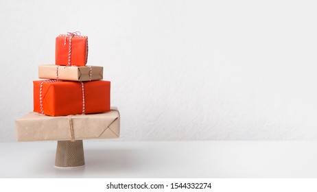 Big Pile Of Creative Wrapped Presents In Shape Of Christmas Tree On White Background, Panorama, Copy Space