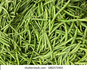 Big Pile Of Organic Green Beans And Farmers Market Grocers Fresh Produce Stand