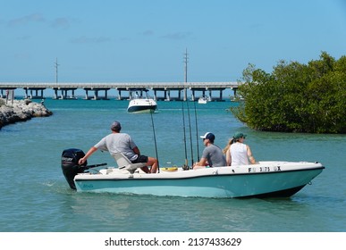 Big Pine Key, Florida, U.S.A - February 20, 2022 - A boat with fisherman leaving the dock near Bahia Honda State Park