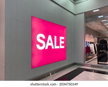 Big Pink Ad, Poster With The Inscription - Sale. On The Gray Wall. For Women. There Are Big Discounts In The Store. No People