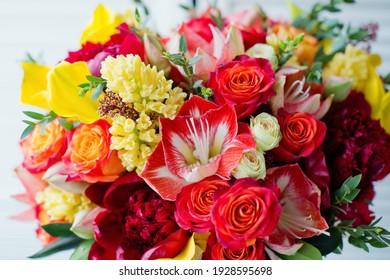 Big Pink Gift Box With Bright Flowers. Red And Yellow Flowers, Bouquet For Mothers Day, Valentines Day, Birthday Party Or Other Holidays. Bouquet With Roses, Calla Lily, Amaryllis And Peonies.