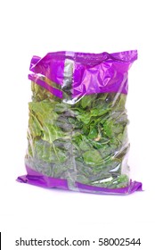 A Big Plastic Bag Full Of Fresh Healthy Organic Shredded And Washed Spinach. Image Isolated On White Studio Background.