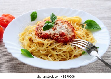Big Plate Of Pasta With Tomato Basil Sauce And Parmesan