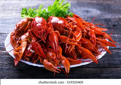 Big Plate Of Tasty Boiled Crawfish Closeup On Wooden Table, Seafood Dinner, Nobody