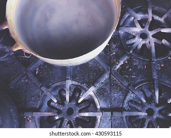 Big Pot On The Dirty Stovetop Background