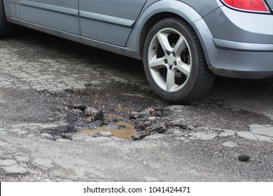 Big pothole caused by freezing and rain in Rome, Italy - Shutterstock ID 1041424471