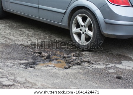 Big pothole caused by freezing and rain in Rome, Italy