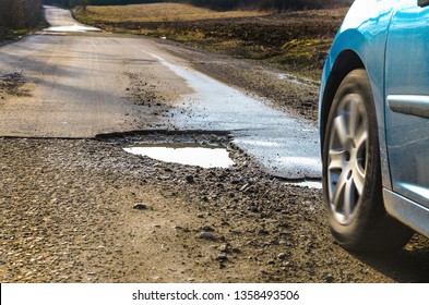 Big Pothole On Road After Winter