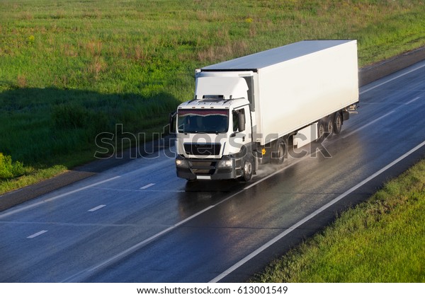 big powerful truck moves\
on highway