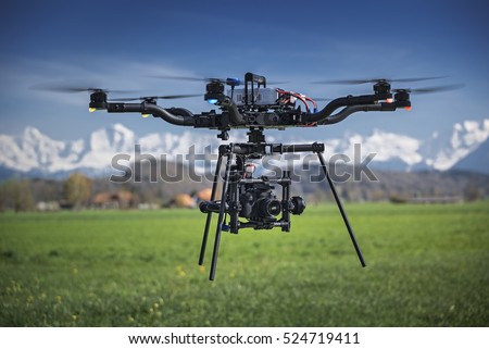 Big professional camera drone in mid-air.