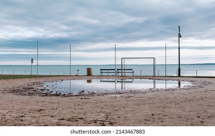 Big Puddle In The Sand On A Warm Winter Day At The Lake Balaton.