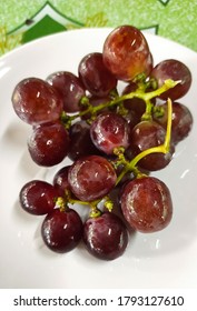 The big purple grapes have a sweet and sour taste.