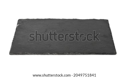 big rectangular black slate stone board isolated on white background, utensils for serving food
