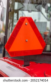 Big Red Reflective Safety Triangle At Farm Tractor