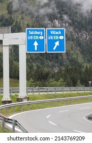 big road sign in the motorway with directions to the city of Salzburg or Villach that towards the Italian borders
