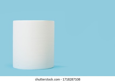 A Big Roll Of Paper Towels On A Blue Background